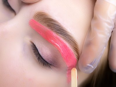close-up of the applied wax on the lower contour of the skin under the eyebrows